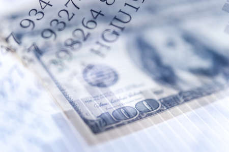 Double exposure Stock market display or forex trading graph and candlestick chart on dollar banknoteの写真素材