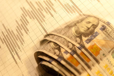 Double exposure Stock market display or forex trading graph and candlestick chart on dollar banknote