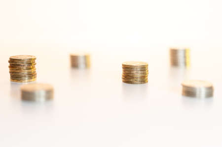Stack of coins macro. Rows of coins for finance and banking concept. Economy trends background.の写真素材