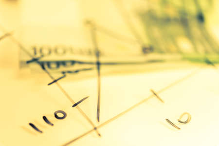 Double exposure Stock market display or forex trading graph and candlestick chart on dollar banknote