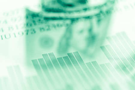 Double exposure Stock market display or forex trading graph and candlestick chart on dollar banknoteの写真素材