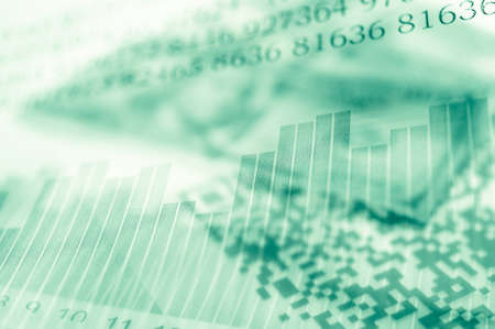 Double exposure Stock market display or forex trading graph and candlestick chart on dollar banknoteの写真素材