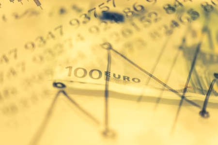Double exposure Stock market display or forex trading graph and candlestick chart on dollar banknoteの写真素材