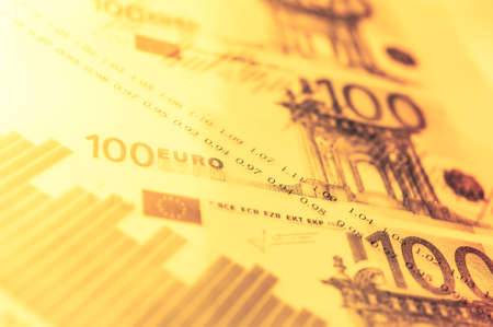 Double exposure Stock market display or forex trading graph and candlestick chart on euro banknoteの写真素材