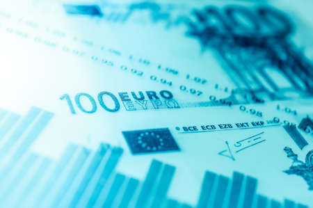 Double exposure Stock market display or forex trading graph and candlestick chart on euro banknoteの写真素材