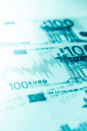 Double exposure Stock market display or forex trading graph and candlestick chart on euro banknoteの写真素材