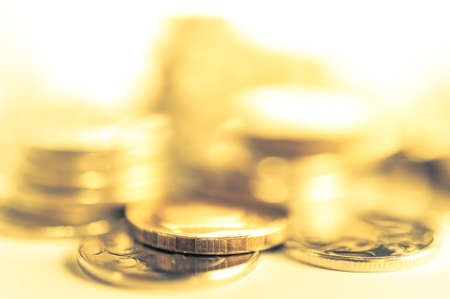 Stack of coins macro. Rows of coins for finance and banking concept. Economy trends background.の写真素材