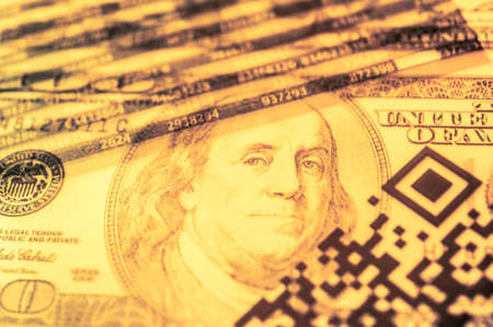 Double exposure Stock market display or forex trading graph and candlestick chart on dollar banknoteの写真素材