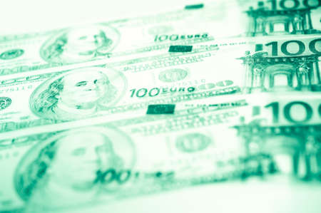 Close-up view of cash money euro and dollars bills background. Finance and business concept.の写真素材