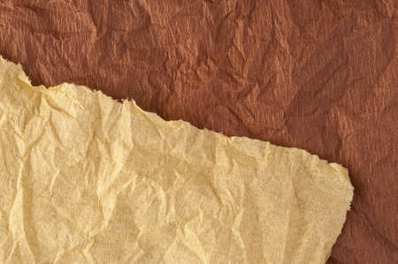 Multi-colored crumpled real vivid paper sheets texture background. Brown, beige.の写真素材