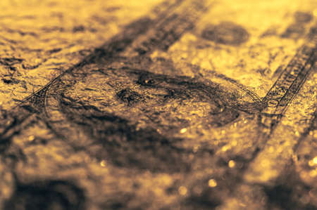Closeup Benjamin Franklin on the 100 dollar grunge art abstract background. Dark, gloomy, crumpled.の写真素材