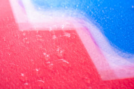 Drops on a shiny surface with a motion blur effect. Violet tonality in the style of the 80-90s.の写真素材