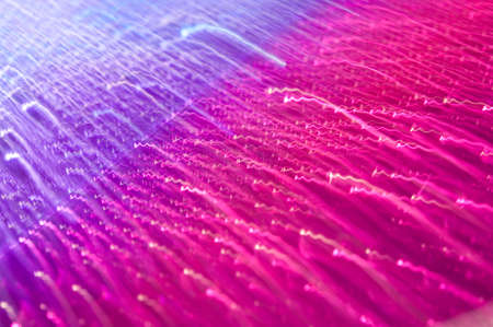 Drops on a shiny surface with a motion blur effect. Violet tonality in the style of the 80-90s.