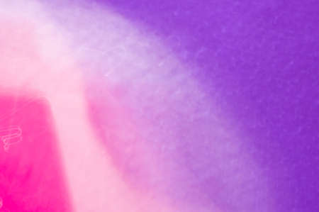 Drops on a shiny surface with a motion blur effect. Violet tonality in the style of the 80-90s.