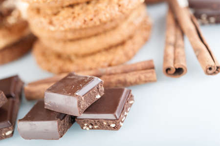 Various shortbread, oat cookies, chocolate chip biscuit and pieces of chocolate with seeds and nuts.の写真素材
