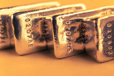 Precious shiny gold bars. Background for finance banking concept. Trade precious metals. Bullions.の写真素材