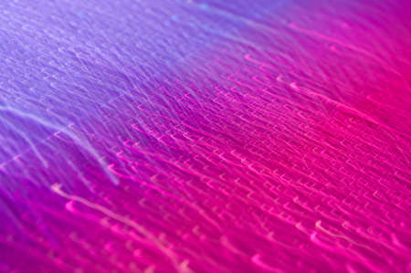 Drops on a shiny surface with a motion blur effect. Violet tonality in the style of the 80-90s.の写真素材