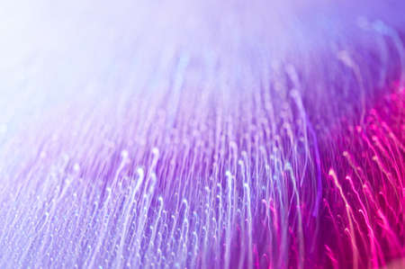 Drops on a shiny surface with a motion blur effect. Violet tonality in the style of the 80-90s.の写真素材