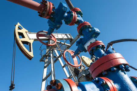 Oil pump, industrial equipment. Rocking machines for extraction of oil. Mining. Petroleum concept.の写真素材