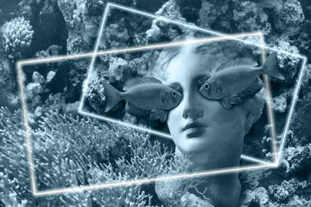 Face of ancient statue on a underwater background with corals and fish. Art, adventure, underwater archeology concept.の写真素材