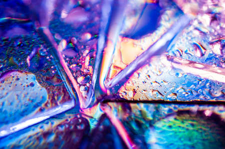 Background in the style of the 80-90s. Real texture of broken glass or ice and drops in bright acid...