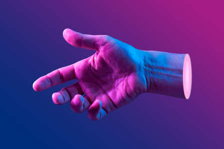 Hand in a pop art collage style in neon bold colors. Modern psychedelic creative element with human palm for posters, banners, wallpaper. Copy space for text. Magazine style template. Zine culture.の写真素材