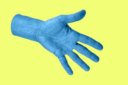 Hand in a pop art collage style in neon bold colors. Modern psychedelic creative element with human palm for posters, banners, wallpaper. Copy space for text. Magazine style design. Zine culture.の写真素材