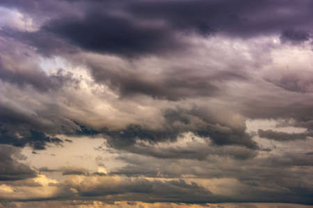 Natural sky composition. Dark ominous colorful storm rain clouds. Dramatic sky. Overcast stormy...