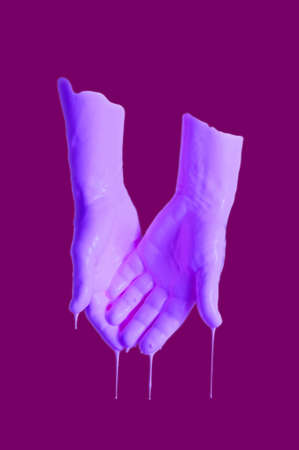 Human palms dipped in color paint. Painted hands. Liquid drips off fingers. Gesture. Contemporary art collage. Abstract surreal pop art style. Modern concept image. Zine culture. Funky minimalism.の写真素材