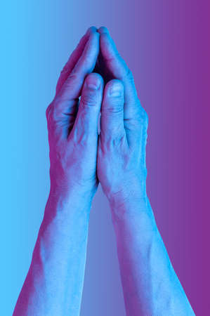 Hands in a surreal style in violet blue neon colors. Modern psychedelic creative element with human palm for posters, banners, wallpaper. Copy space for text. Magazine style template. Pop art culture.の写真素材