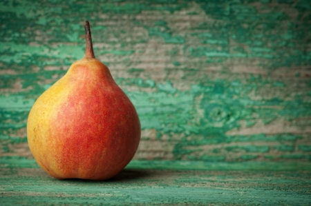 sweet pear closeup on wooden backgroundの写真素材