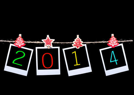 New year 2014  Blank photos hanging on rope