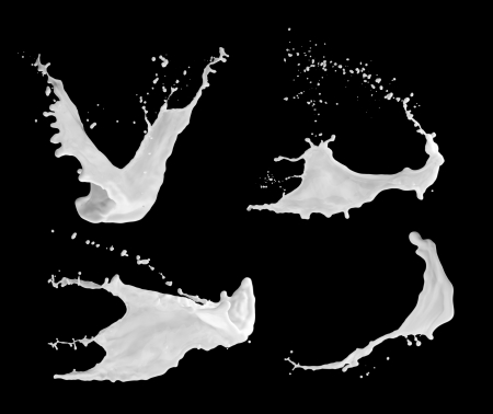 milk splash on the black surfaceの写真素材