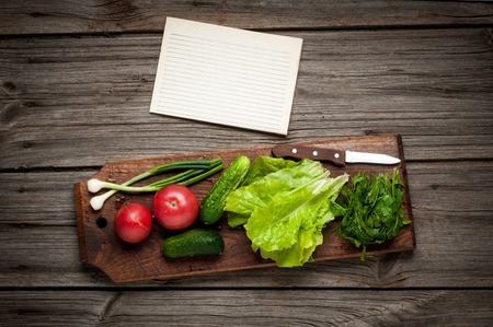 Close up of various colorful raw vegetables with paper sheet and free spaceの写真素材