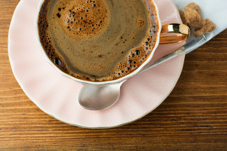 cup of coffee on wooden table top viewの写真素材