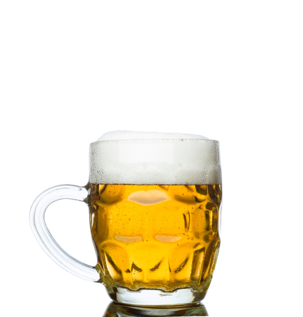 Mug full of fresh beer isolated on white backgroundの写真素材