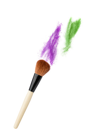 powderbrush isolated on white background with colofull dustの写真素材