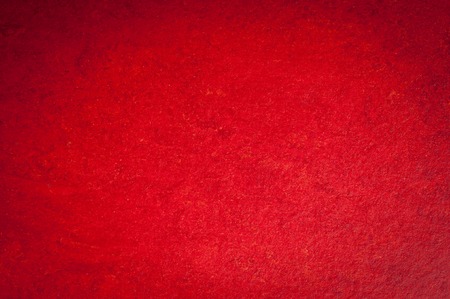 A vintage red background with a crisscross mesh pattern and grunge stains.の写真素材