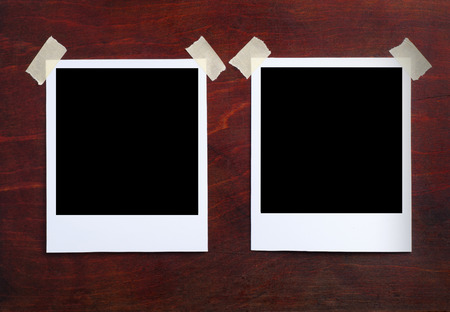 old pictures on a wooden background close upの写真素材