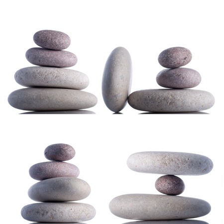 Hanging or floating rocks isolated on white inside studio.