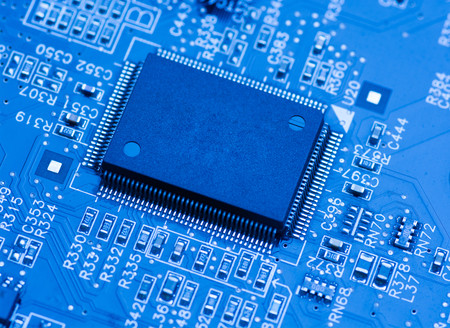 blue circuit board background of computer motherboard close up