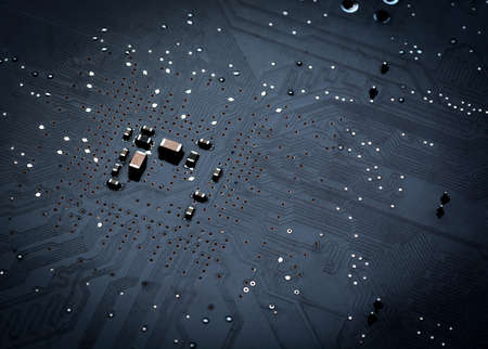 Close up of a printed black computer circuit board top viewの写真素材