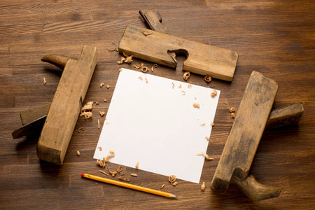 Old wooden jointers on the wood table with grunge textureの写真素材