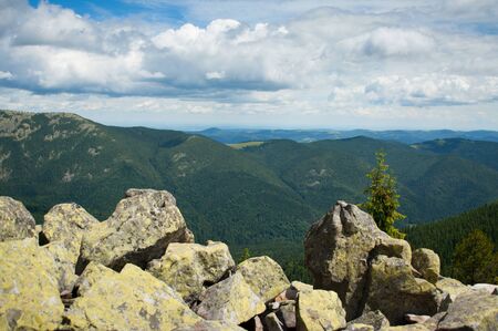 Beautiful mountain landscape. Mountains are visible to the horizon. Cloudy sky.の写真素材