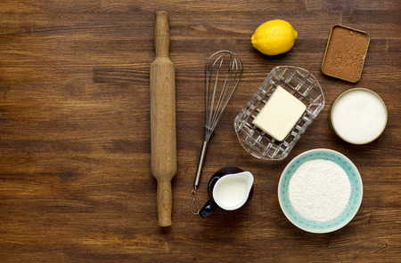baking background with eggshell and rolling pin on wooden table