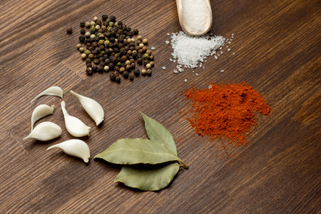 Colorful spices on rustic wooden table top viewの写真素材