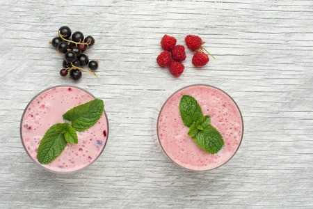 Fresh smoothies on wooden background with fresh mint . Top view.の写真素材