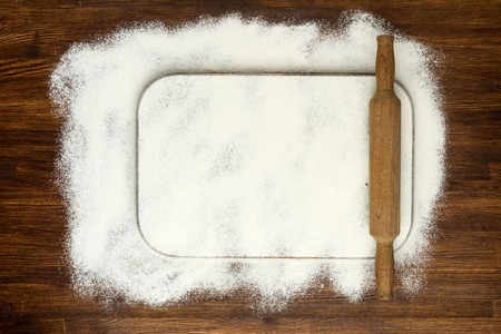 Rural vintage wood kitchen table with blank cook book and cooking tools. Background with free recipe text space.の写真素材
