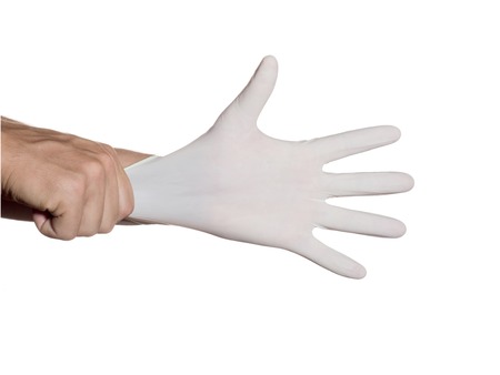 Doctor dress gloves on hands to protection and care for patients. Isolated on white background.の写真素材