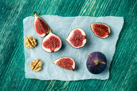 Fresh fruits - figs on the wooden table. Top viewの写真素材